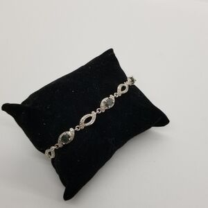 PAJ Prime Art & Jewel silver tone tennis bracelet with dark gray stones
